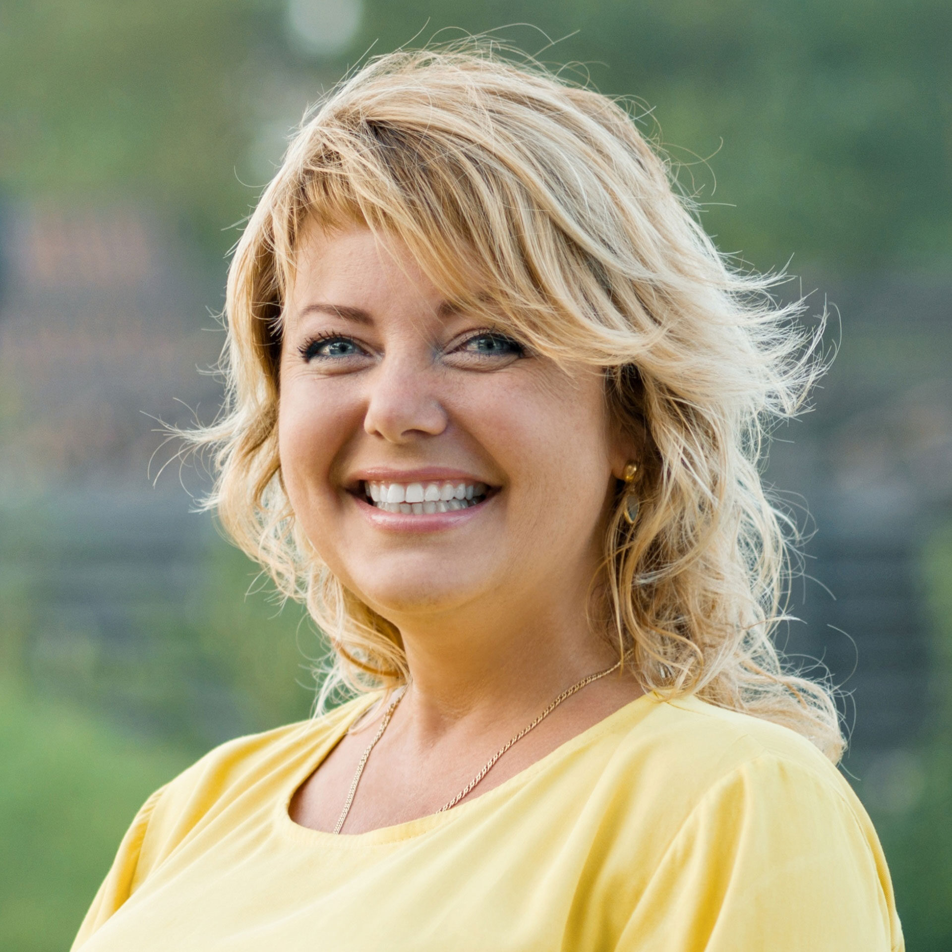 middle-aged woman smiling at camera