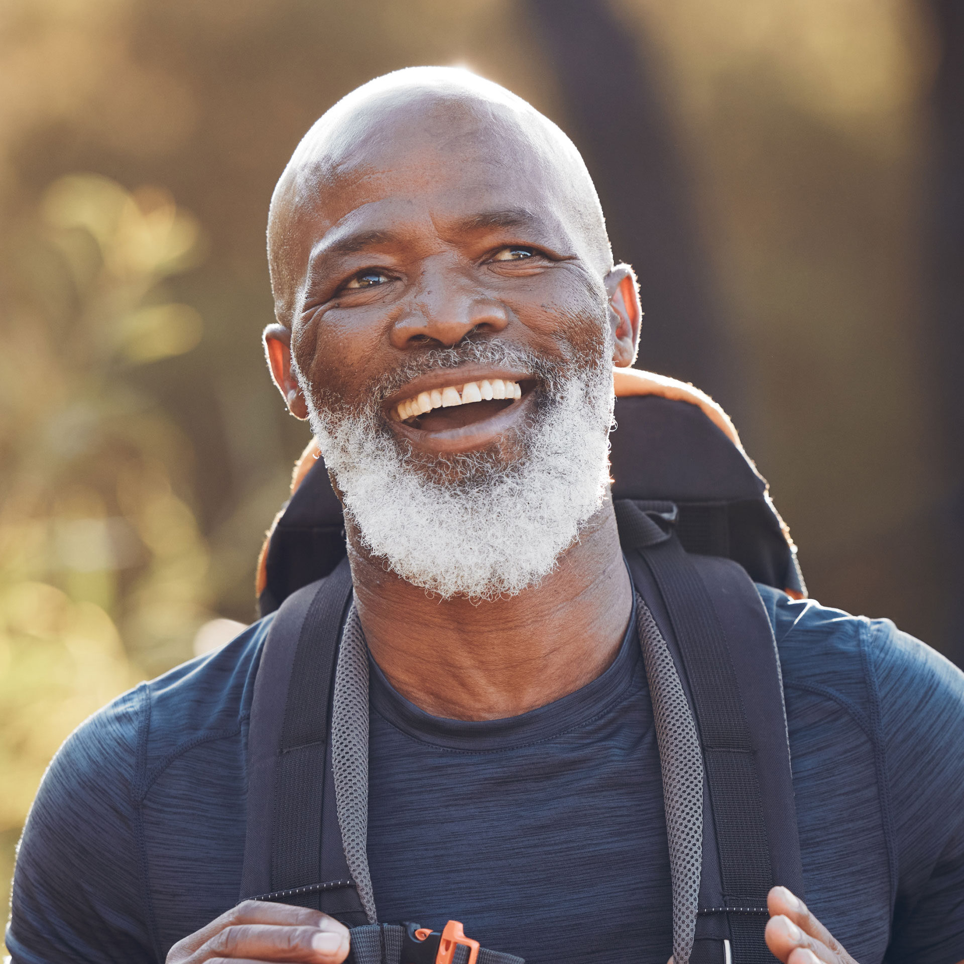 older african american man wearing backpack during outside activity